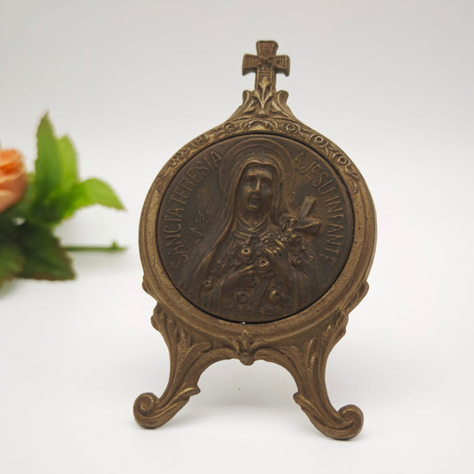 Cast metal holy image of Therese of Lisieux Sancta Teresia A Jesu Infante Christian Catholic table display icon altar medallion relief medal relic pilgrimage home altar